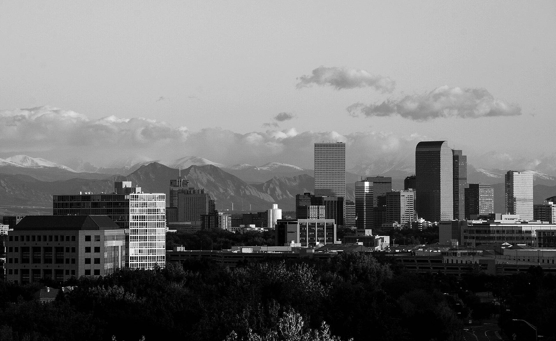 Downtown Denver with the Rocky Mountains behind